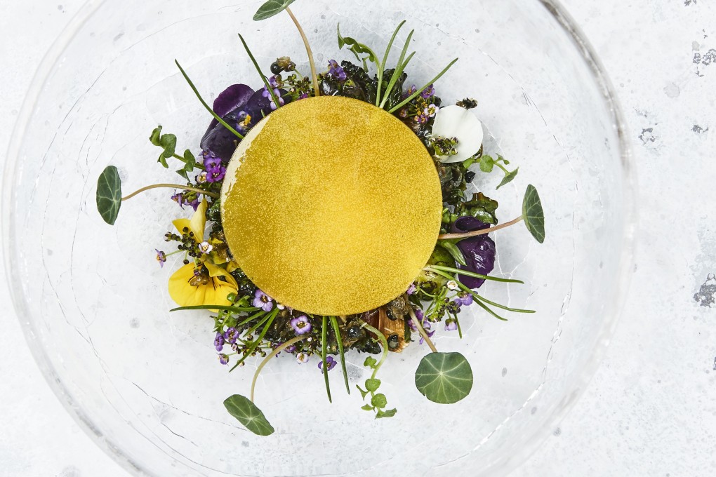 Oven-roasted winter vegetables, smoked egg yolk and melted Vesterhavs cheese, a dish at three-Michelin-star Copenhagen restaurant Geranium.