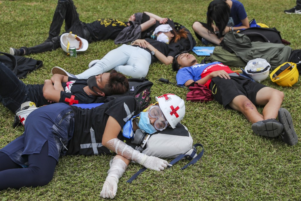 A moment of rest after remaining overnight on the streets following Hong Kong’s second massive protest march in two weeks, against the extradition bill and calling on Chief Executive Carrie Lam to resign. Photo: Sam Tsang