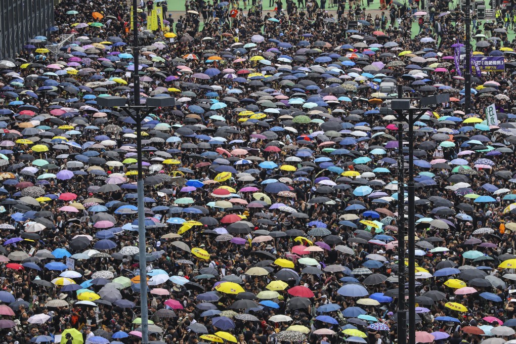 Protesters gather at the Victoria Park starting point ahead of the march on Sunday, as a senior Executive Council member insists the Hong Kong economy remains in a stable condition despite unrest. Photo: Edmond So