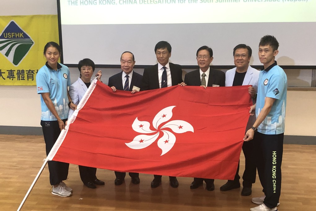Hong Kong hurdler Vera Lui presents the Hong Kong flag with team officials that include Commissioner of Sport, Yeung Tak-keung (centre) at a flag presentation ceremony at Baptist University. Photo: Chan Kin-wa