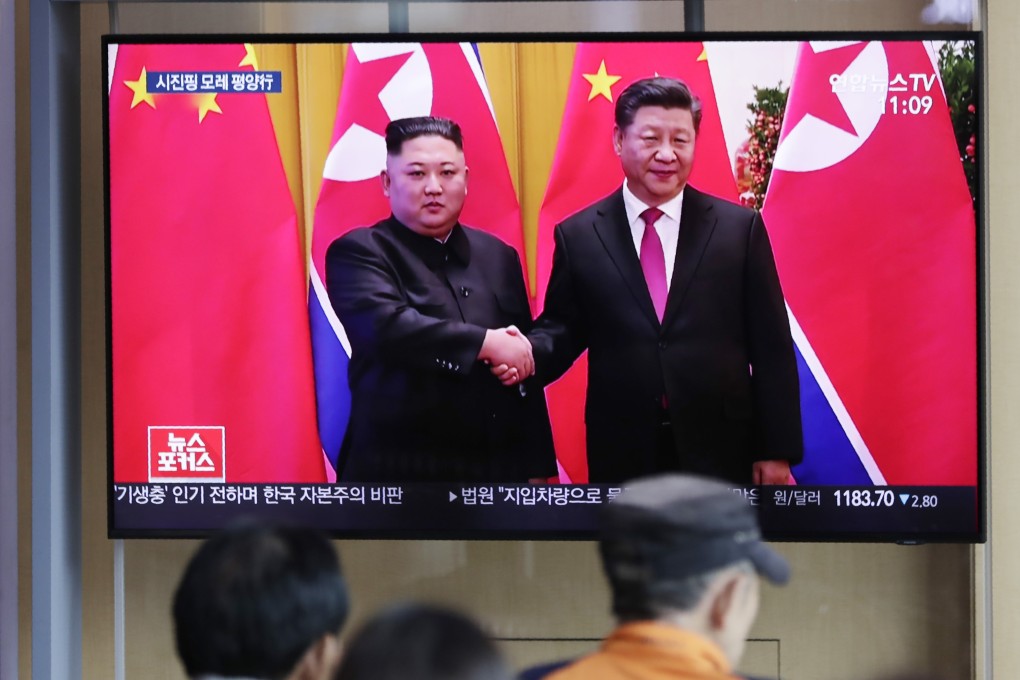 South Korean rail passengers watch TV footage of a previous meeting between Kim Jong-un and Xi Jinping at a station in Seoul. Photo: AP