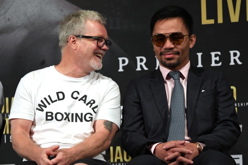 Trainer Freddie Roach laughs with Manny Pacquiao during the press conference for their fight against Keith Thurman at The Beverly Hills Hotel. Photo: AFP