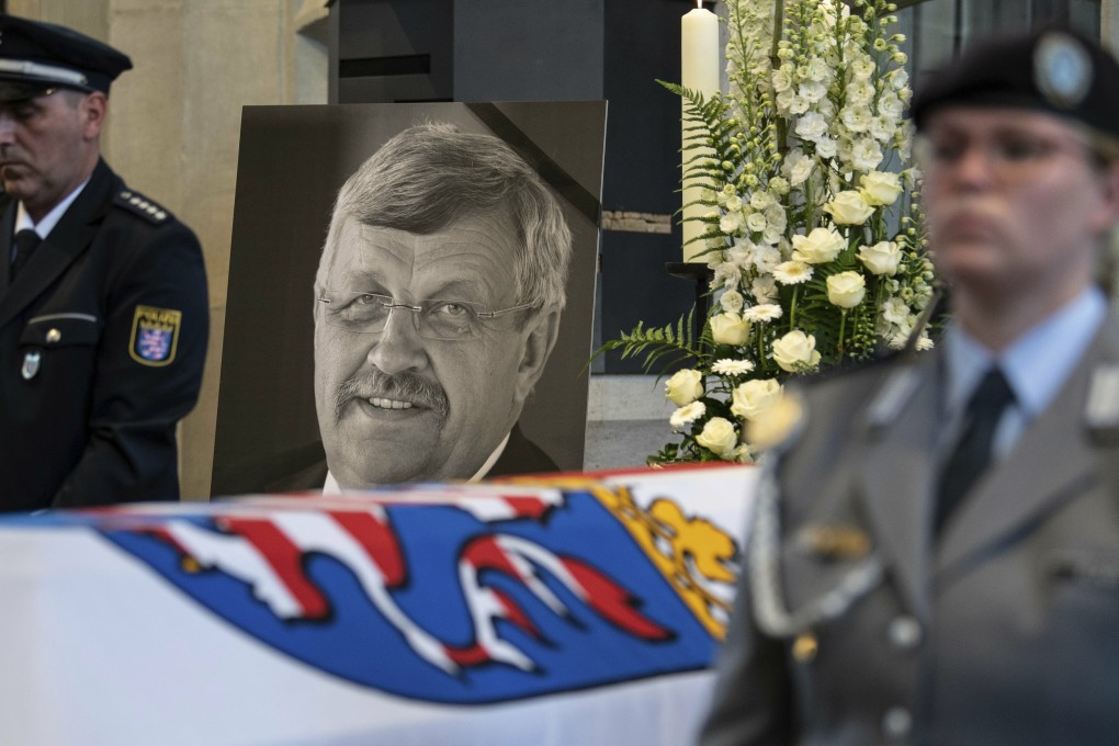 A picture of murdered politician Walter Luebcke stands behind his coffin during the funeral service in Kassel, Germany. Photo: AP