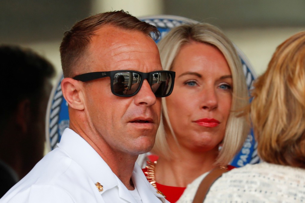 Navy Seal Special Operations Chief Edward Gallagher leaves court with his wife Andrea. Photo: Reuters