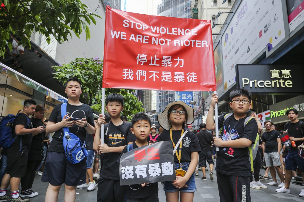 Children join the demonstrators marching to the government headquarters to protest against the extradition bill, in Causeway Bay on June 16. Photo: Winson Wong