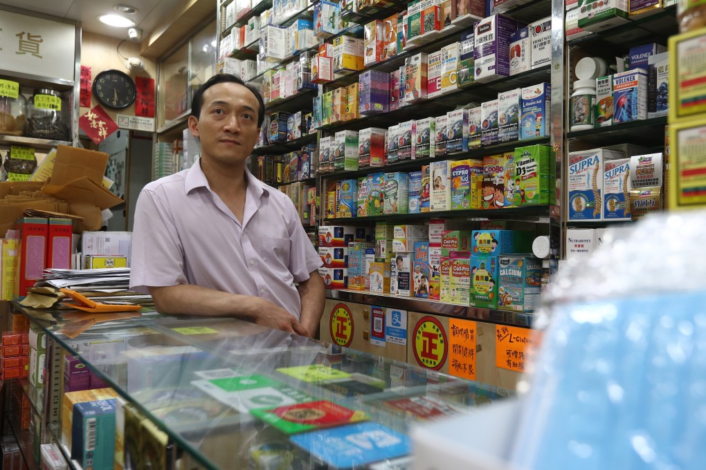 Alan Cheung, owner of Sands Medicine Shop, is costing the costs of the protests. Photo: Nora Tam