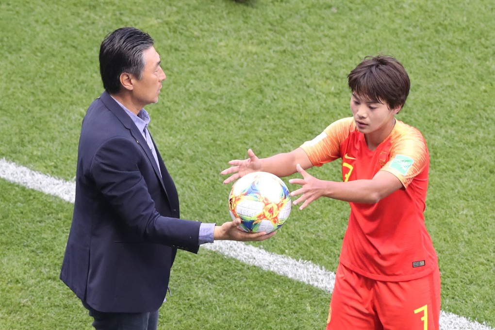 China head Coach Jia Xiuquan hands the ball to Wang Shuang during a Fifa Women’s World Cup match. Photo: Xinhua