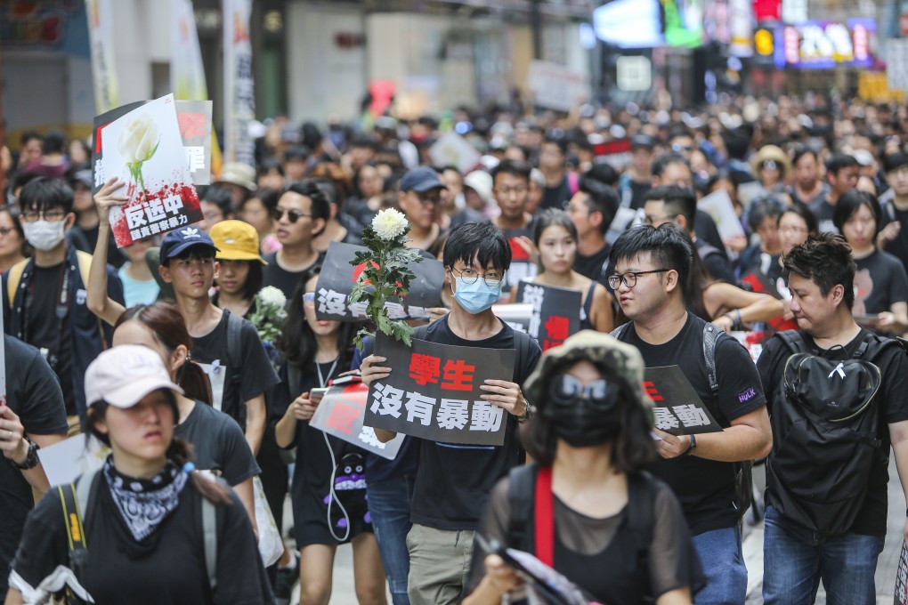 Young anti-extradition bill protesters clad in black flood Causeway Bay and march to the government headquarters in Tamar, Admiralty, calling on Chief Executive Carrie Lam to resign, on June 16. Photo: Winson Wong