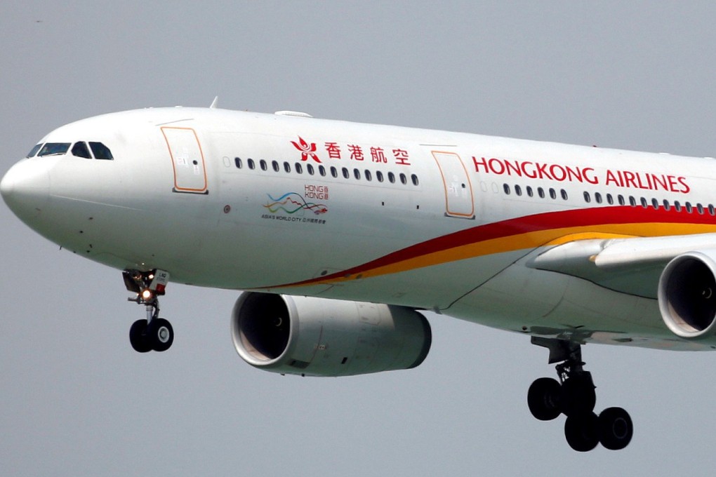 A Hong Kong Airlines passenger plane landing at Hong Kong International Airport. Photo: Reuters