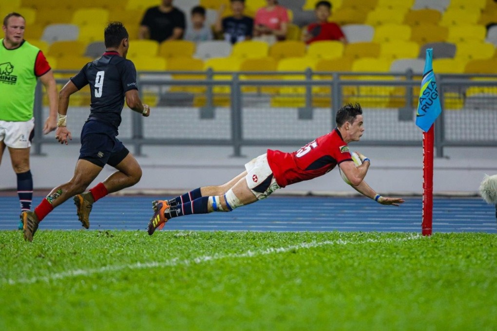 Paul Altier dives in for a try against Malaysia.