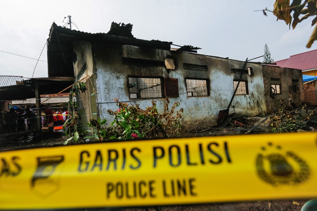 The burnt-out house that doubled as a light workshop in Binjai, North Sumatra province. Photo: AFP