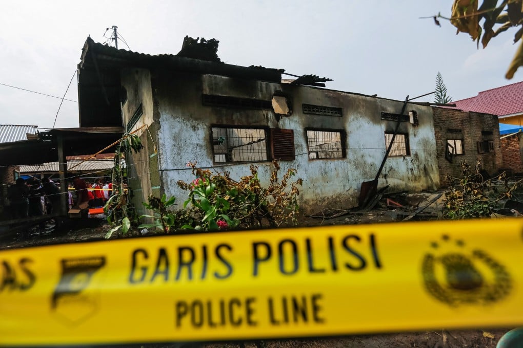 The burnt-out house that doubled as a light workshop in Binjai, North Sumatra province. Photo: AFP