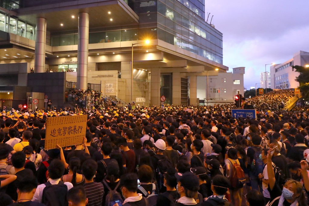 Protesters outside police headquarters in Wan Chai on Friday as a 15-hour siege trapped officers inside. Photo: Edmond So