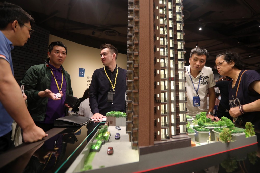 Potential buyers viewing a model of New World Development's Atrium House project on 22 June 2019. Photo: SCMP / Xiaomei Chen