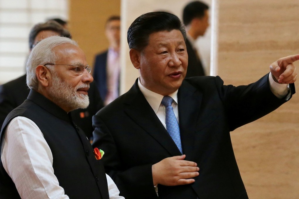 Chinese President Xi Jinping and Indian Prime Minister Narendra Modi talk as they visit the Hubei Provincial Museum in Wuhan, China, on April 27, 2018. China wants an integrated Asian trading bloc and may be willing to accommodate India, which has prioritised domestic manufacturing. Photo: China Daily via Reuters