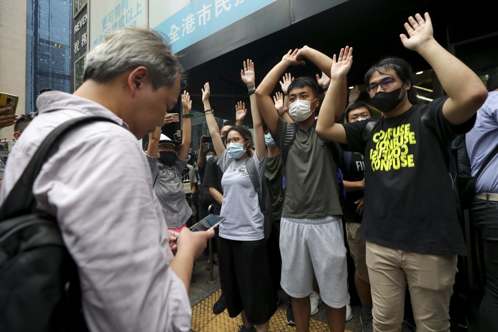 About 100 protesters blocked the ground-floor entrances of Revenue Tower in Wan Chai from noon on Monday as part of their non-cooperation campaign to force the Hong Kong government to agree to their four demands over the extradition bill. Photo: Sam Tsang