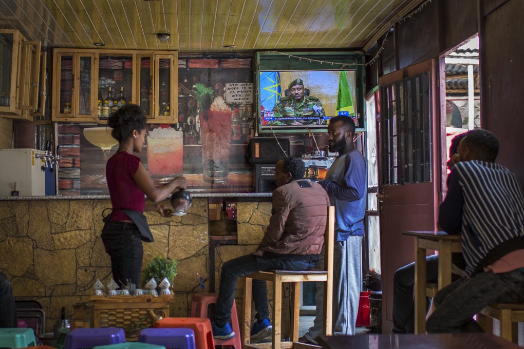 Ethiopians follow the news on television at a cafe in Addis Ababa. Photo: AP Photo