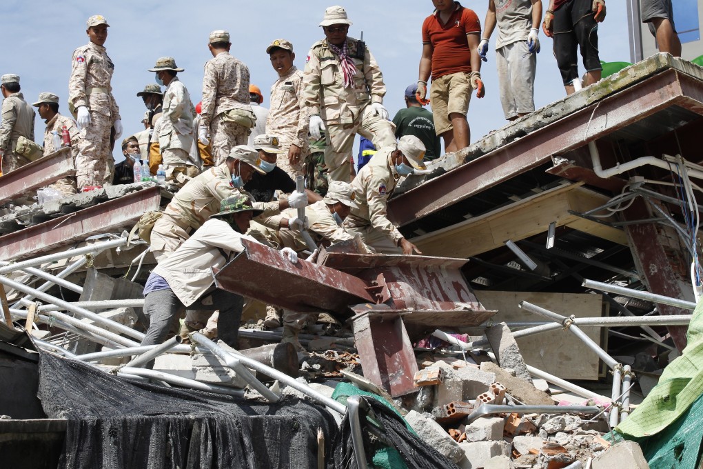 Rescuers search for missing workers at a collapsed building in Preah Sihanouk. Photo: EPA-EFE