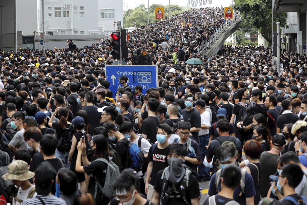 Protesters gather near the police headquarters in Hong Kong on June 21. Photo: AP