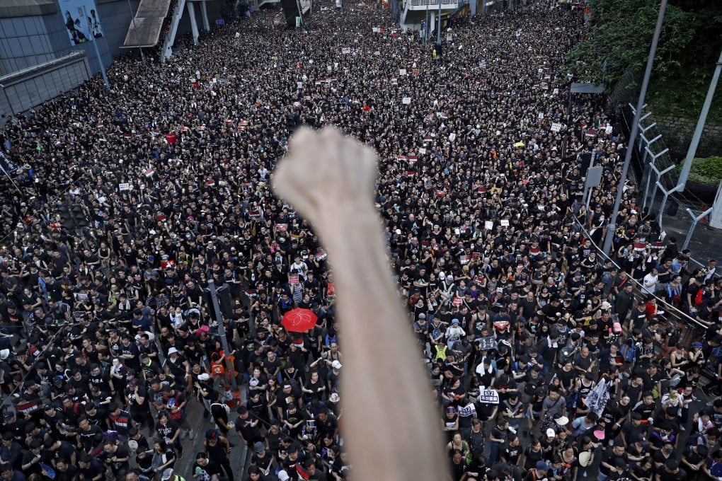 Protesters march against the extradition bill, in Hong Kong on June 16. Many view recent legislative proposals as eroding the city’s judicial independence and, more broadly, as a sign of the central government’s efforts to chip away at the freedoms of this semi-autonomous special administrative region of China. Photo: AP