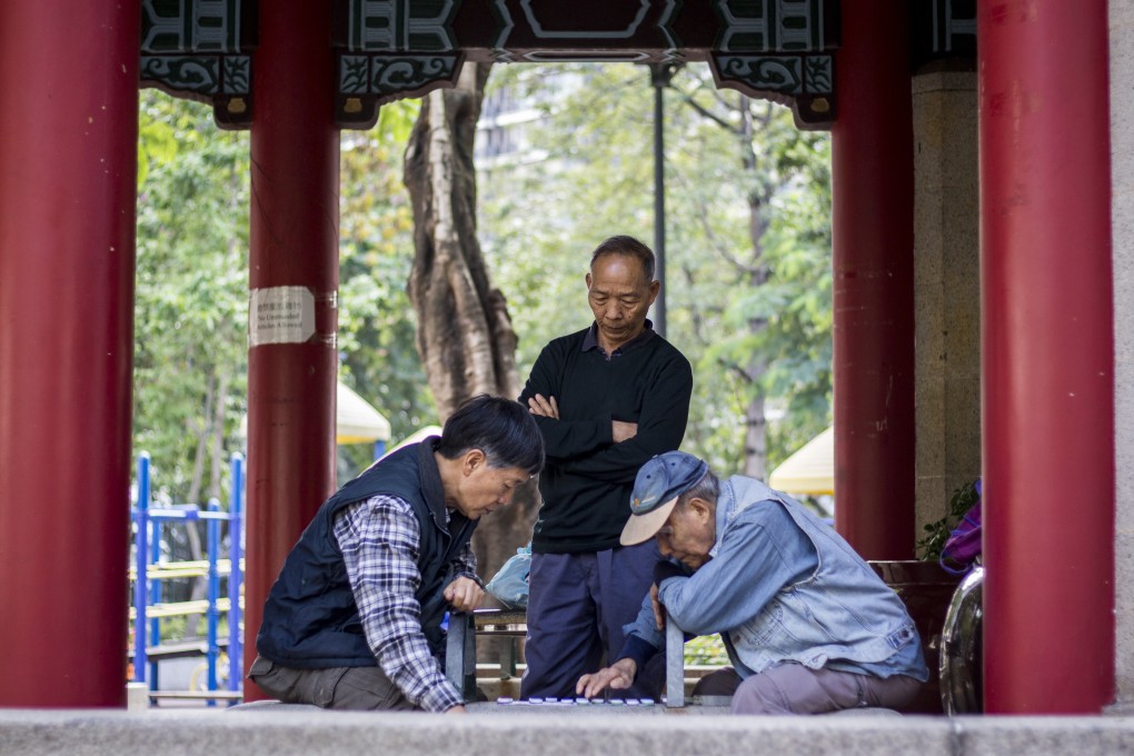 Men play chess in a Chinese-style pavilion in King George V Memorial Park, Kowloon. It is one of two parks named after the British monarch in Hong Kong. Photo: Christopher DeWolf