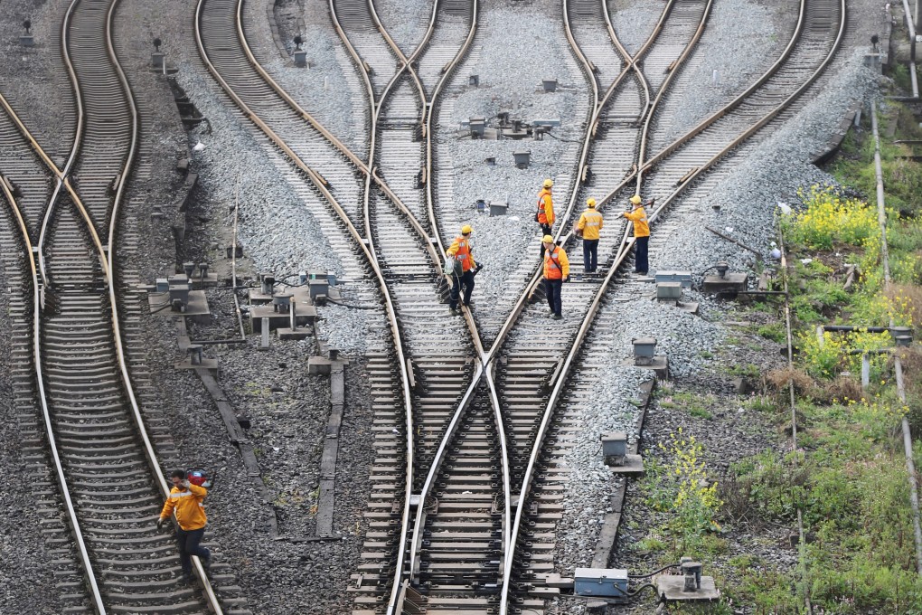 Workers at Dazhou railway station in Sichuan, inspect tracks linking China with Germany on March 14. China’s belt and road is a step in the right direction as it invests in infrastructure to boost regional growth. Photo: Reuters