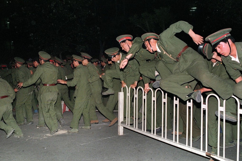 People’s Liberation Army enter Tiananmen Square in Beijing in the early hours of June 4, 1989, when hundreds, possibly thousands, of student protesters were killed by troops. In his new book, Liao Yiwu talks to fellow witnesses to the crackdown about what they saw and their lives since then. Photo: AFP