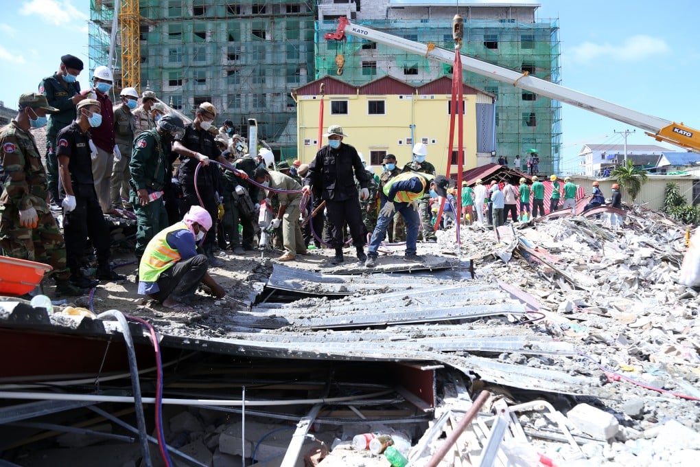 Rescuers search for trapped people in a collapsed building in Sihanoukville city in Preah Sihanouk province, Cambodia. Photo: Xinhua