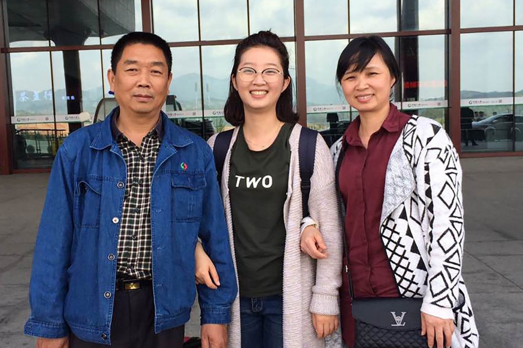 A 2017 photo provided by Zhang Yingying’s brother Zhang Xinyang shows her with their parents, Zhang Ronggao Zhang (right) and Ye Lifeng, at a rail station in Nanping, China. Photo: Zhang Xinyang via AP