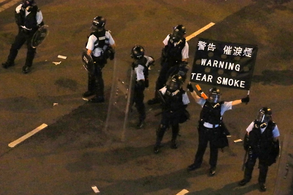Anti-riot police officers warn of imminent tear gas deployment, during anti-extradition bill protests in Admiralty on June 12. Several protesters are believed to have been arrested at public hospitals after seeking medical treatment. Photo: Felix Wong