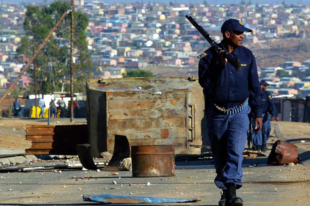 A policeman on patrol during a riot in a township near Johannesburg. File photo: Reuters