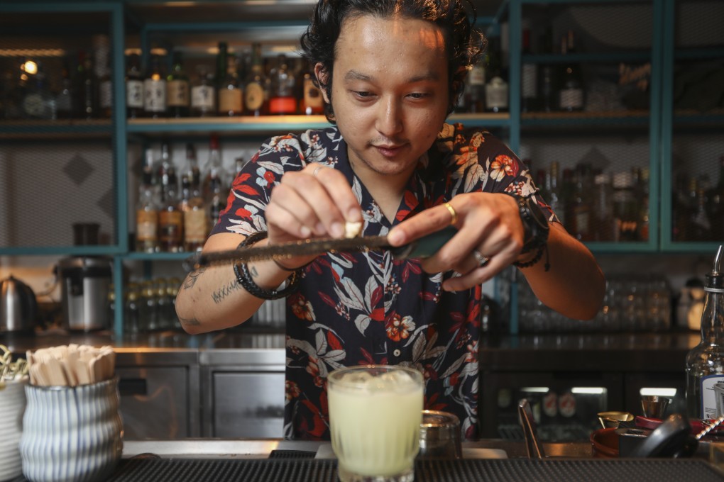 Eshka Gurung mixes a caipirinha at Uma Nota, in Central, Hong Kong. Photo: Chen XIaomei