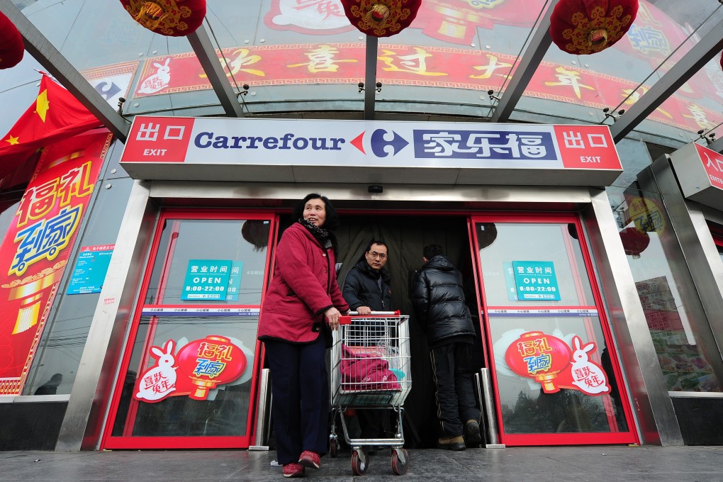 Shoppers at a Carrefour store in Beijing. The French retailer’s 210 hypermarkets in China suffered a 0.3 percentage point erosion in market share to 2.8 per cent at the end of the first quarter on year. Photo: AFP