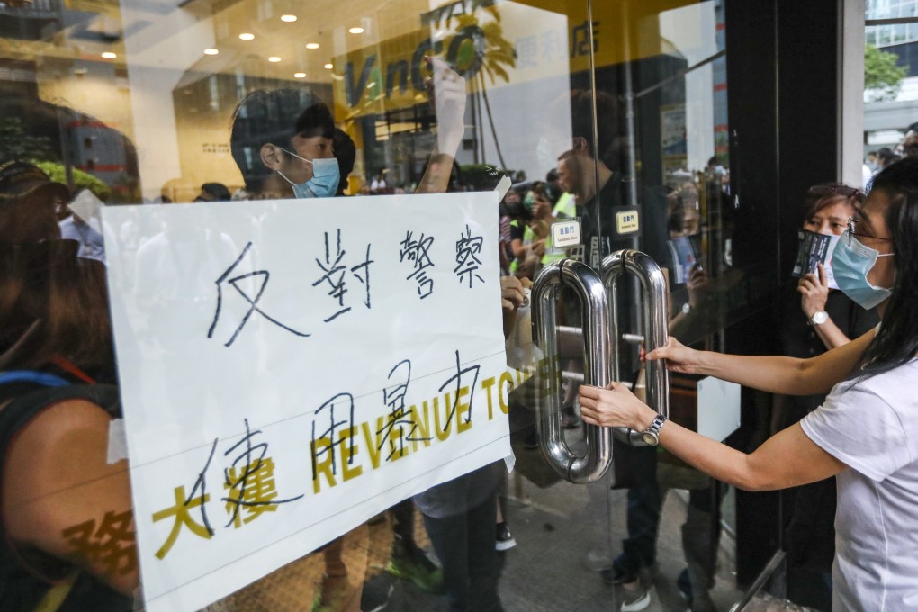 Protesters storm the Revenue Tower in Wan Chai on Monday, demanding the extradition bill be withdrawn. Photo: Felix Wong