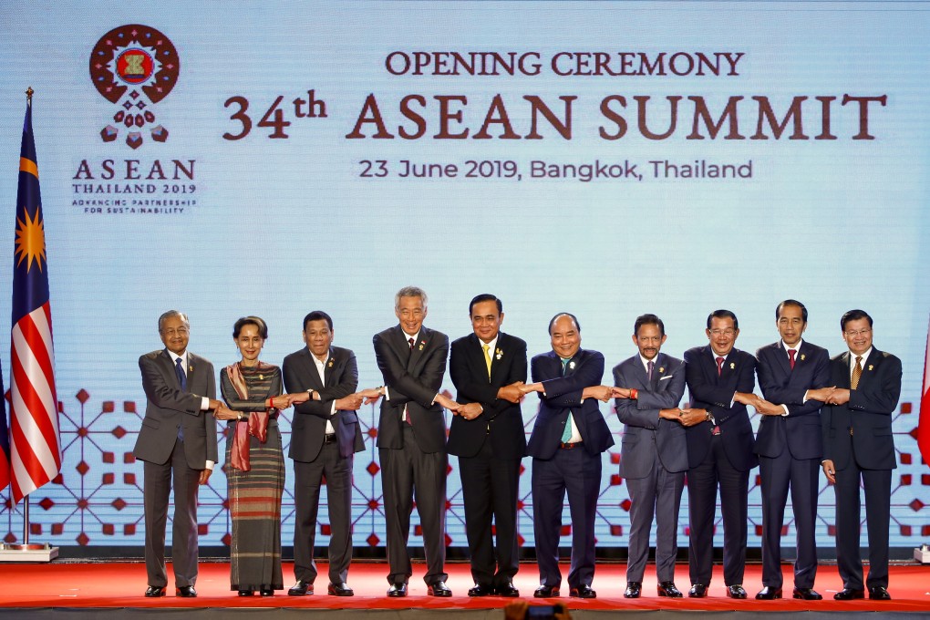 Southeast Asian leaders link hands for a group photo at the opening ceremony of the 34th Asean Summit in Bangkok on June 23. Photo: EPA