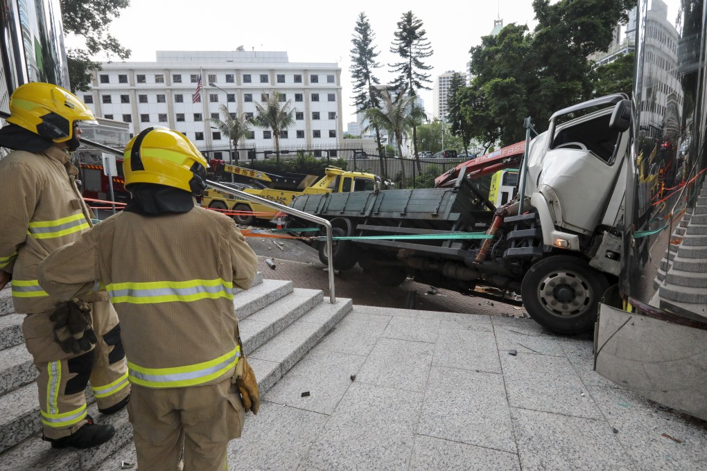 A crane truck smashed into the Peak Tram terminus on Wednesday after losing control. Four people were slightly injured. Photo: Felix Wong