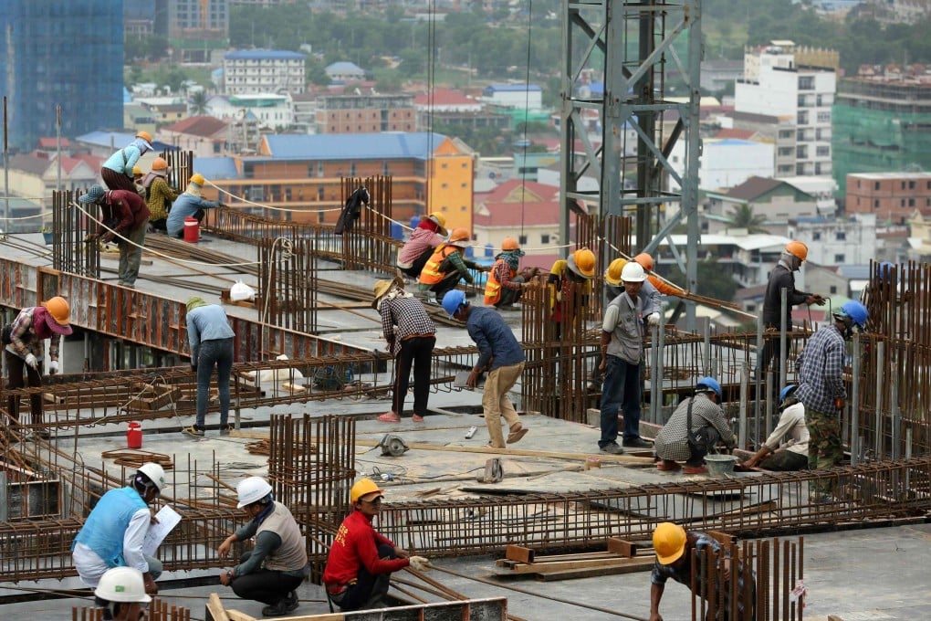 Cambodian labourers work on a high-rise building site in Sihanoukville. Photo: AFP