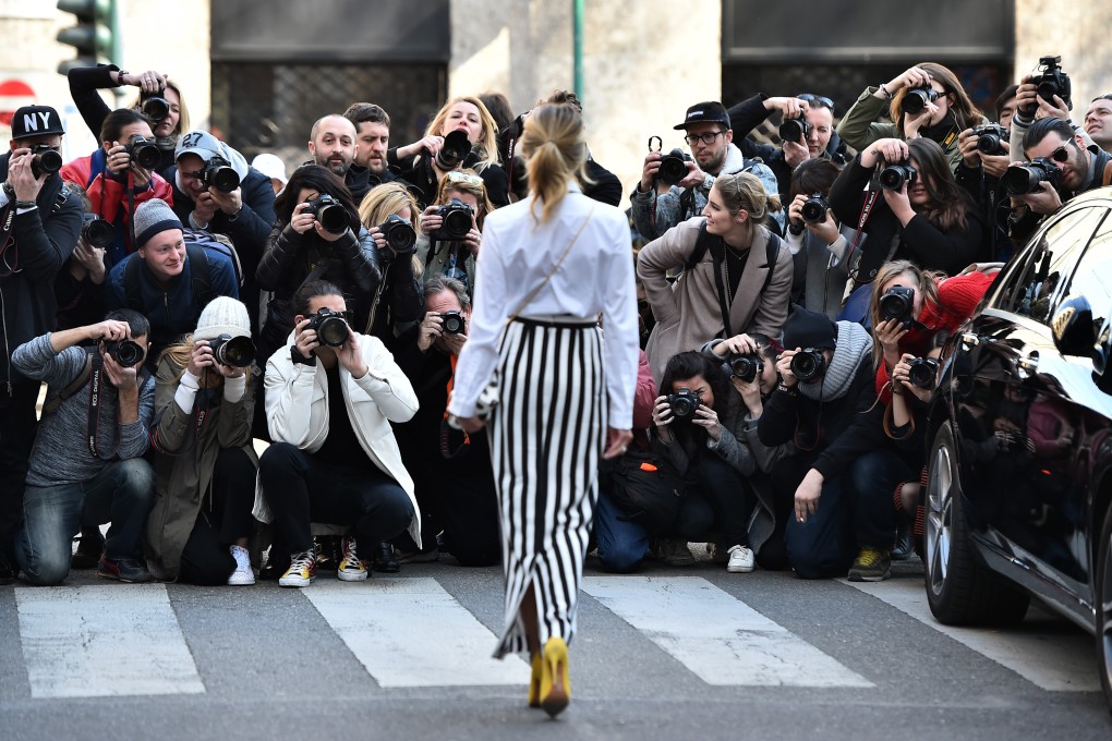 With so many photographers looking to capture the action at fashion weeks, it has become a ruthlessly competitive scene. Photo: AFP