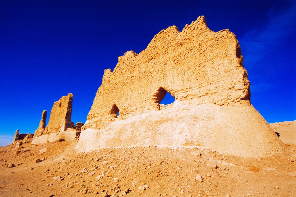 The ruins of a fortified gatehouse and cus­toms post at Yunmenguan Pass, in China’s Gansu province. Photo: Alamy