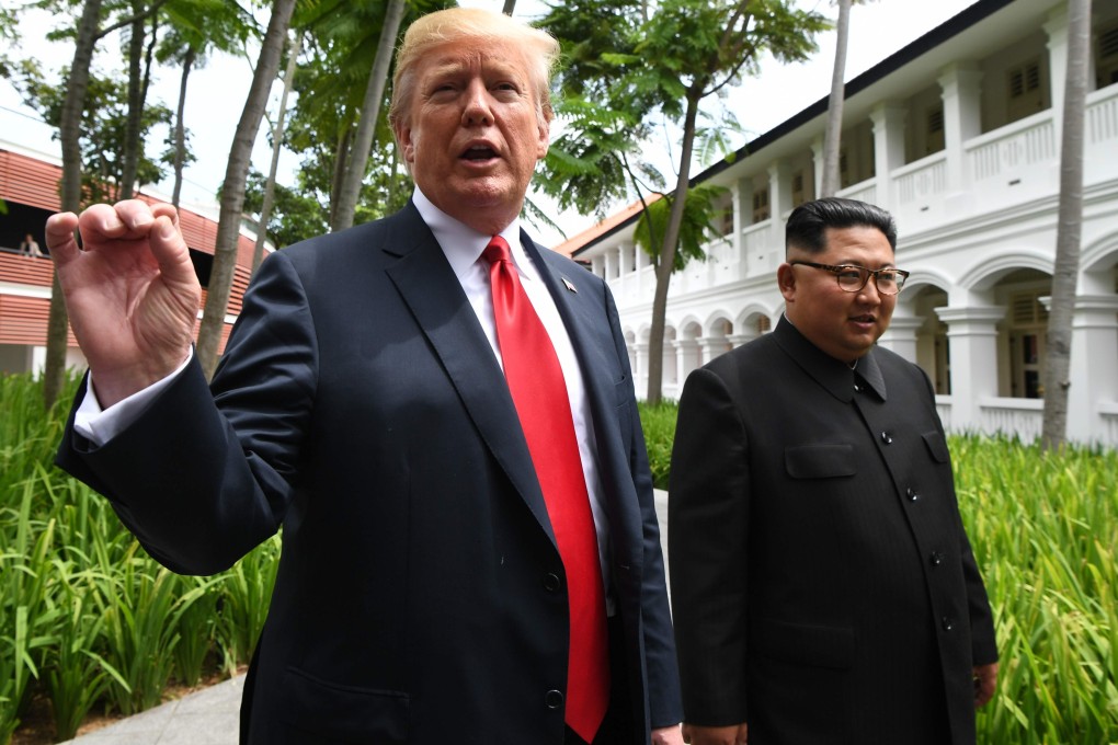 US President Donald Trump walks with North Korea's leader Kim Jong-un in Singapore in June 2018. Photo: AFP