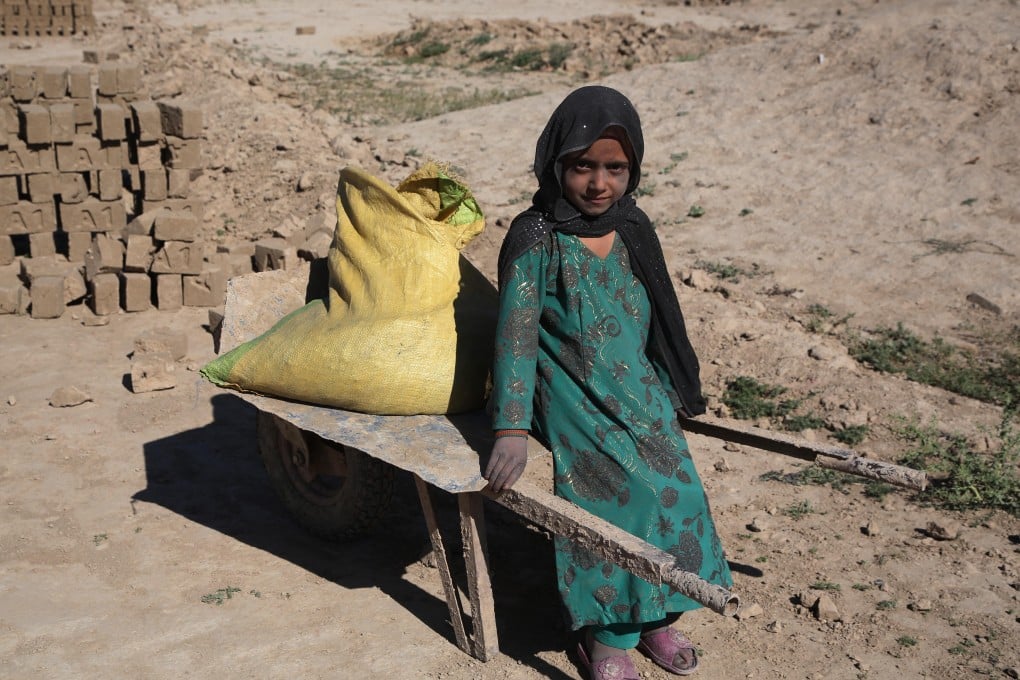An Afghan child works at a brick factory in Kabul. As the global economic mood sours, the plight of the world’s poorest people is set to worsen. Photo: Xinhua