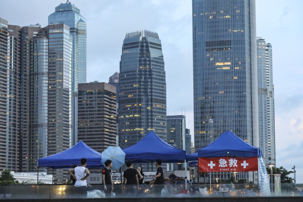 Protesters opposed to the extradition bill remain outside the government headquarters in Admiralty, flanked by Hong Kong’s commercial district, on June 18. Photo: Dickson Lee
