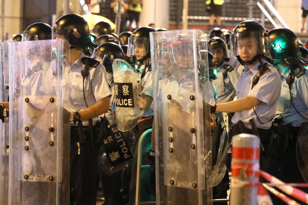 Riot police outside the force’s headquarters in Wan Chai on Wednesday night. Photo: Dickson Lee