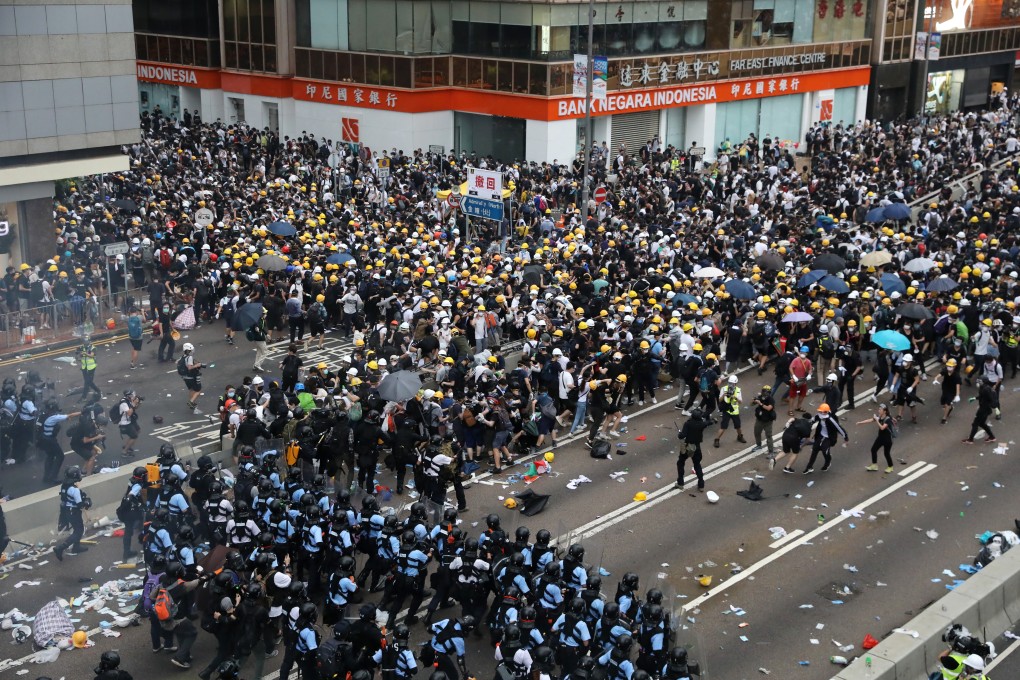 Police use tear gas to push anti-extradition bill protesters further along Harcourt Road, in Admiralty on June 12. Photo: K.Y. Cheng
