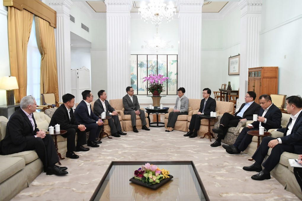 Chief Executive Carrie Lam, flanked by Commissioner of Police Stephen Lo (left), and Secretary for Security John Lee (right), meets the chairmen and vice-chairmen of four police unions at Government House to offer their members her full support. Photo: Handout
