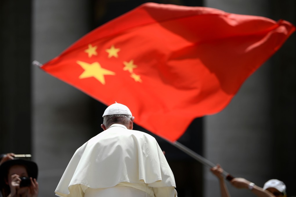 A member of the crowd waves the flag of China as Pope Francis leaves following the weekly general audience at St Peter's Square earlier this month. Photo: AFP