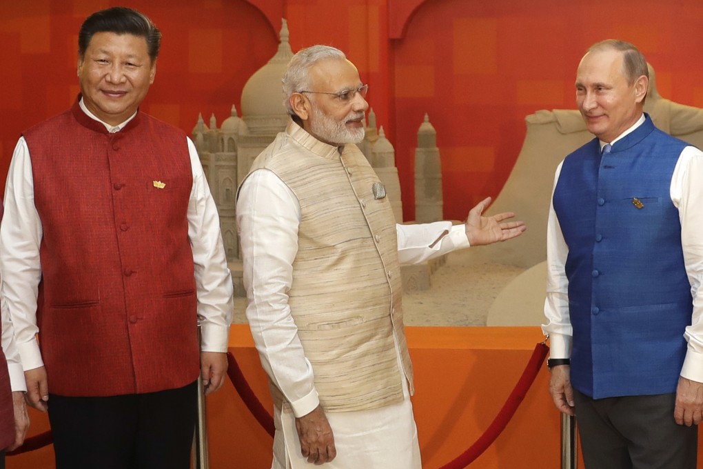 Chinese President Xi Jinping with Indian Prime Minister Narendra Modi and Russian President Vladimir Putin at a BRICS summit in Goa, India in 2016. Photo: AP