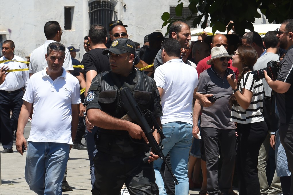 Tunisian security forces secure the area near the site of an attack in the Tunisian capital's main avenue Habib Bourguiba on June 27. Photo: AFP