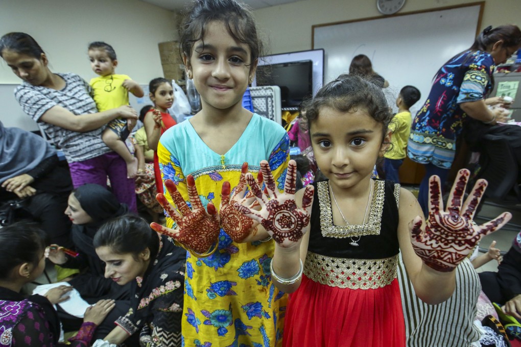 Children show off their henna-painted hands as they prepare to celebrate Eid al-Fitr, the festival that marks the end of the fasting month of Ramadan, in To Kwa Wan in June 2018. Photo: Edmond So