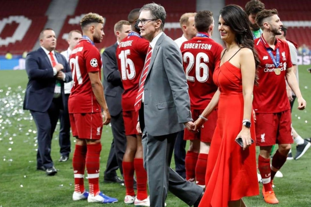 Liverpool owner John W. Henry and his wife Linda Pizzuti on the Wanda Metropolitano pitch after the Champions League triumph in Madrid. Photo: Reuters